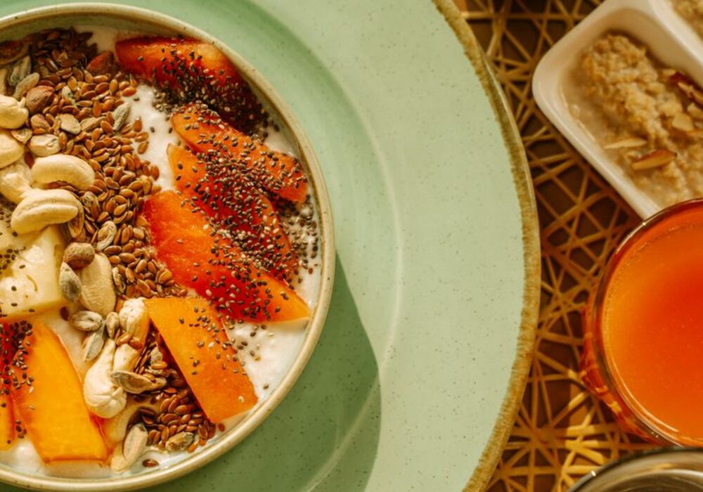 Healthy meal with fresh fruit, seeds and nuts