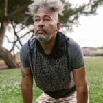Man in his fifties exercising outdoors in a park