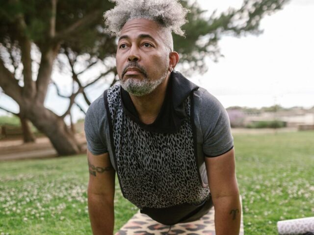 Man in his fifties exercising outdoors in a park