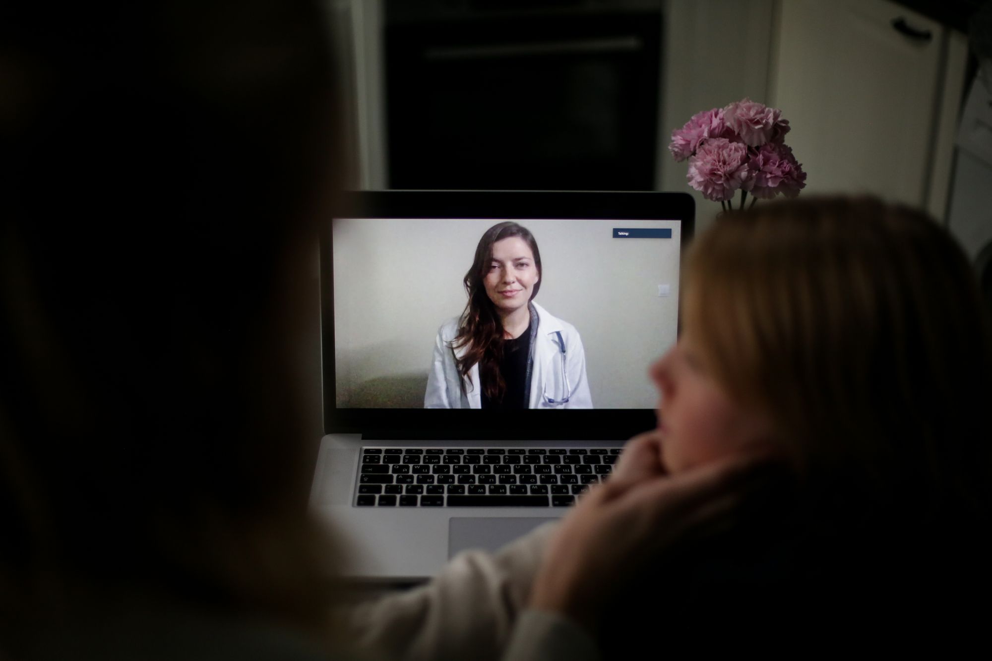 Patient at home on a video call with a licensed provider