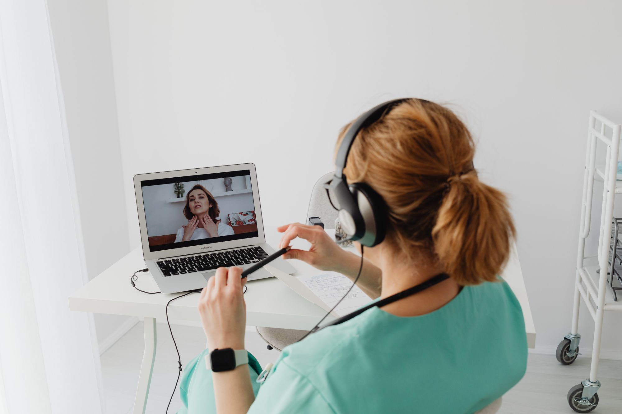 Clinician on a video call discussing a care plan with a patient